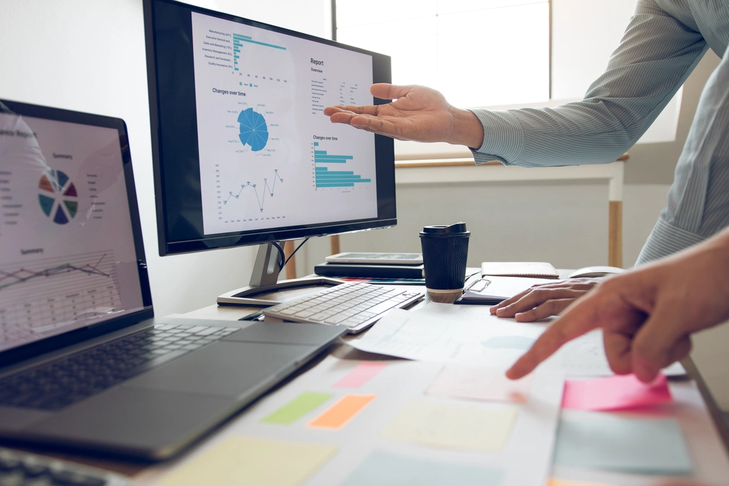 Businessman point to the graph of the company